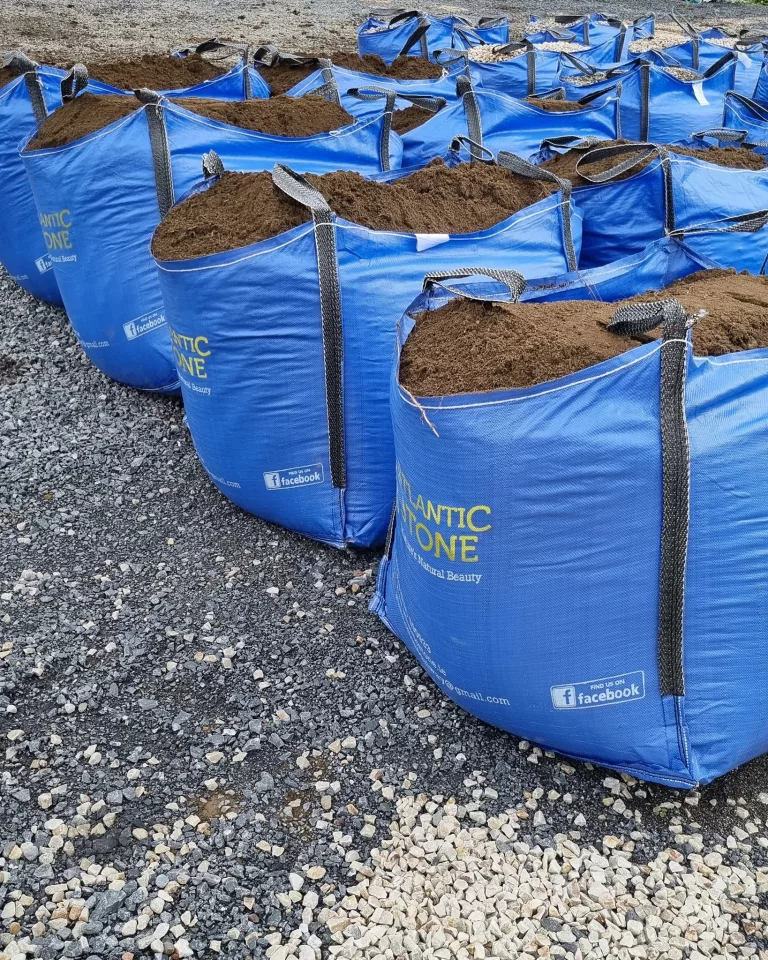 Bags of decorative stone and topsoil being delivered — high-quality landscaping materials for garden projects in Dublin, Galway.
